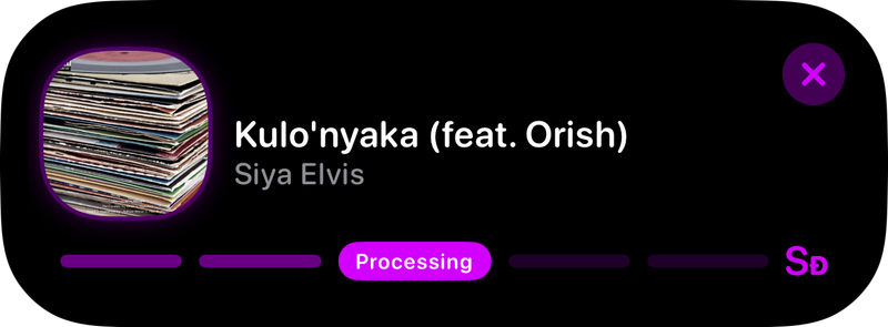 The Shared Live Activity in the expanded Dynamic Island showing Processing in the Purple tint, dark appearance.